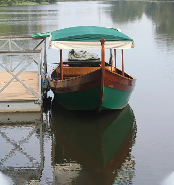 Shikara boat Alleppey journey to Chambakulam Church through Kerala's tranquil backwaters and picturesque landscapes.